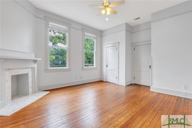420 E Bolton St, Savannah, GA 31401 - unfurnished living room featuring light wood-style flooring, ceiling fan, baseboards, and visible vents