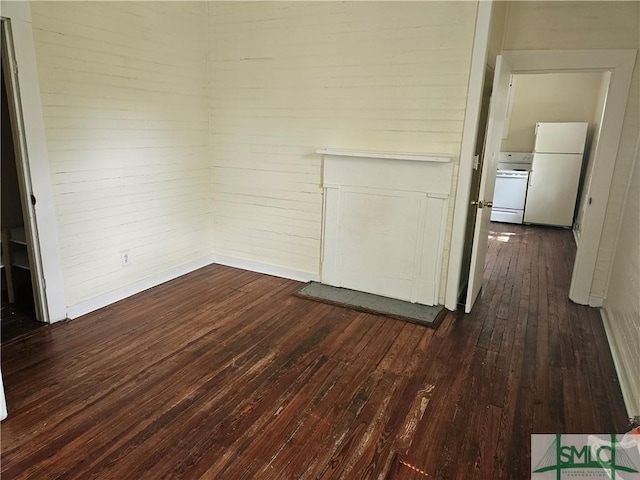 638 E 37th St, Savannah, GA 31401 - spare room featuring dark wood-type flooring and brick wall