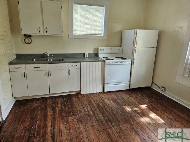 638 E 37th St, Savannah, GA 31401 - kitchen with white appliances, a sink, dark wood-type flooring, dark countertops, and white cabinetry
