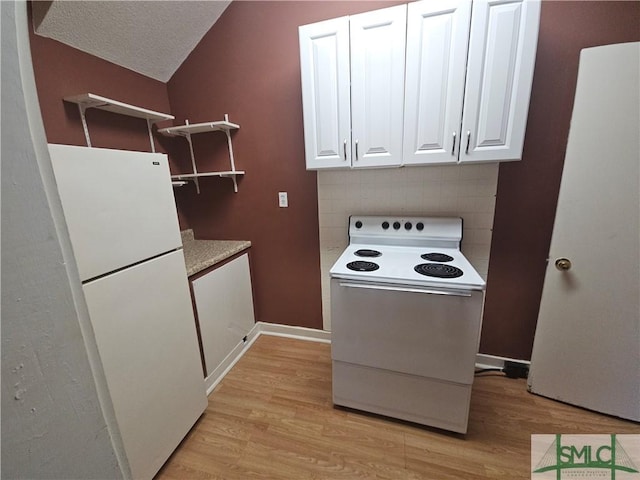 638 E 37th St, Savannah, GA 31401 - kitchen with white appliances, light wood-style floors, white cabinets, and light countertops