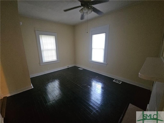 638 E 37th St, Savannah, GA 31401 - spare room with plenty of natural light, dark wood-style floors, ceiling fan, and baseboards