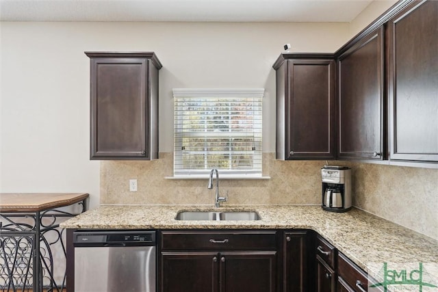 646 Red Oak Ln, Hinesville, GA 31313 - kitchen featuring backsplash, a sink, light stone countertops, stainless steel dishwasher, and dark brown cabinets
