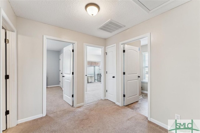 646 Red Oak Ln, Hinesville, GA 31313 - unfurnished bedroom featuring carpet flooring, a textured ceiling, baseboards, and visible vents