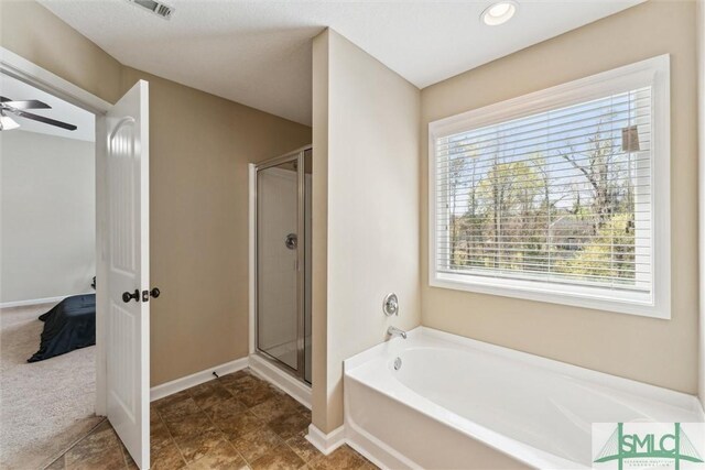 646 Red Oak Ln, Hinesville, GA 31313 - full bathroom with a stall shower, baseboards, a garden tub, and visible vents
