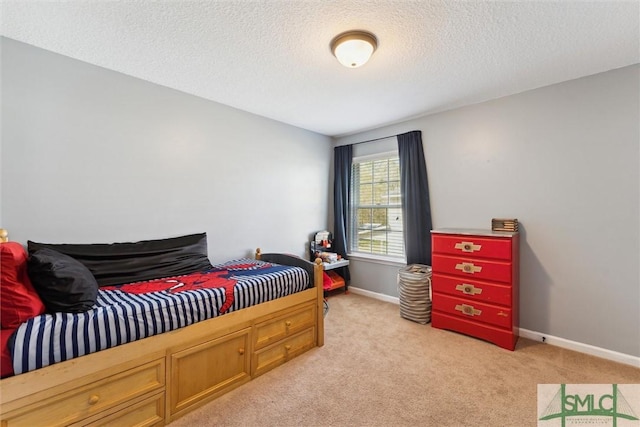 646 Red Oak Ln, Hinesville, GA 31313 - bedroom featuring light carpet, baseboards, and a textured ceiling