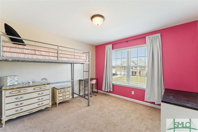 646 Red Oak Ln, Hinesville, GA 31313 - bedroom featuring baseboards, carpet, and a textured ceiling