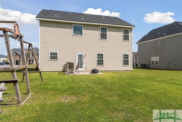 646 Red Oak Ln, Hinesville, GA 31313 - rear view of property featuring a lawn, central AC, and a patio
