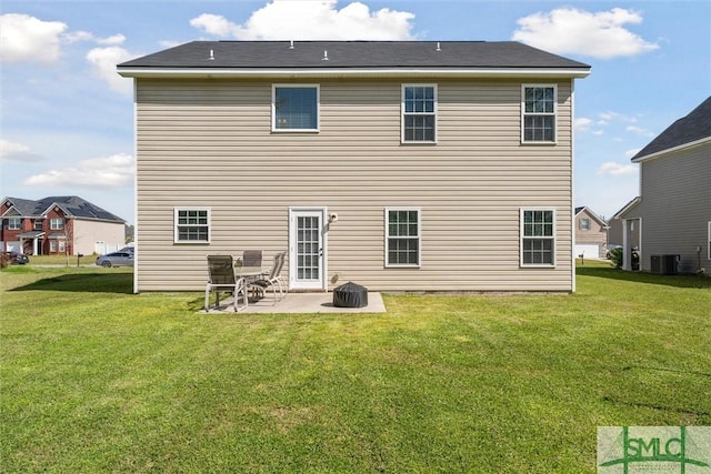 646 Red Oak Ln, Hinesville, GA 31313 - rear view of property featuring a lawn, central air condition unit, and a patio area