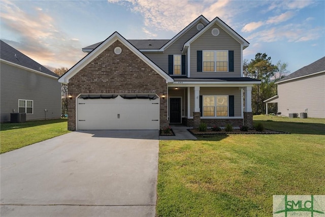 646 Red Oak Ln, Hinesville, GA 31313 - view of front of home with a lawn, driveway, an attached garage, and brick siding
