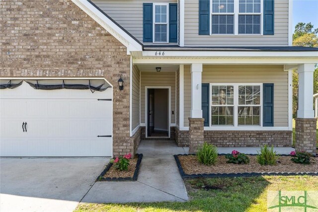 646 Red Oak Ln, Hinesville, GA 31313 - property entrance featuring brick siding and concrete driveway