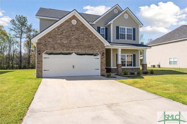 646 Red Oak Ln, Hinesville, GA 31313 - view of front of house featuring brick siding, a front yard, driveway, and a garage