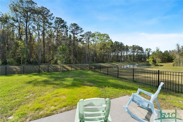 148 Spring Hill Dr, Richmond Hill, GA 31324 - view of yard with a fenced backyard and a water view