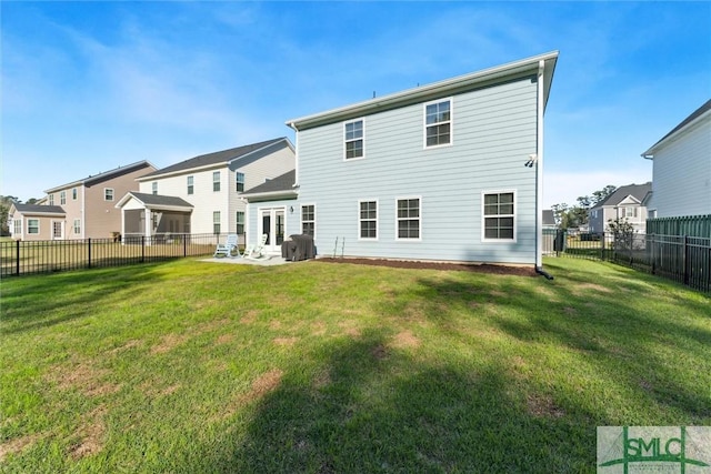 148 Spring Hill Dr, Richmond Hill, GA 31324 - rear view of house with a fenced backyard, a residential view, a patio, and a yard