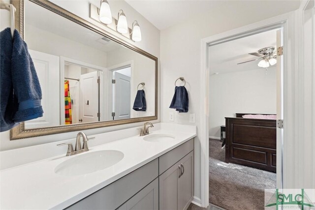 148 Spring Hill Dr, Richmond Hill, GA 31324 - full bathroom featuring double vanity, a sink, and ceiling fan