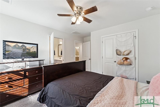 148 Spring Hill Dr, Richmond Hill, GA 31324 - carpeted bedroom with visible vents, connected bathroom, and ceiling fan