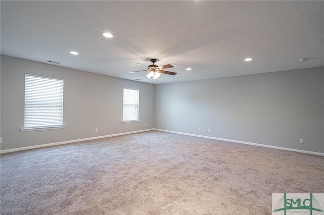 402 Walthour Dr, Rincon, GA 31326 - spare room with carpet, a ceiling fan, a textured ceiling, baseboards, and recessed lighting