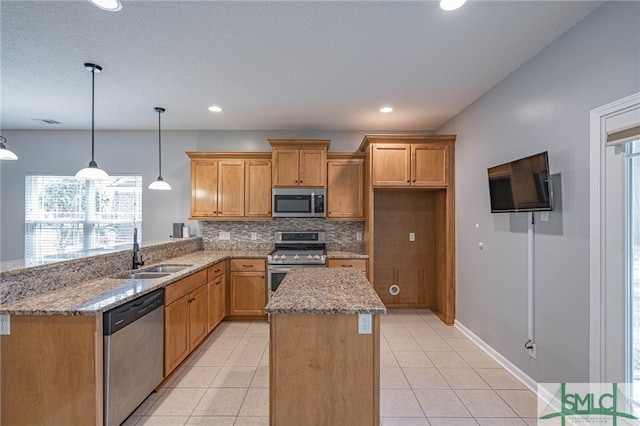 402 Walthour Dr, Rincon, GA 31326 - kitchen featuring stainless steel appliances, a sink, tasteful backsplash, light stone countertops, and recessed lighting