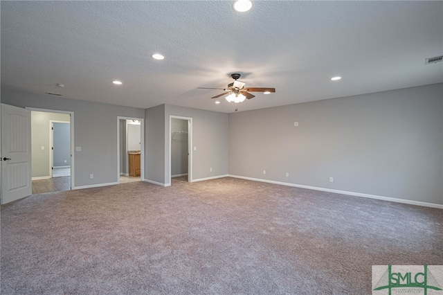 402 Walthour Dr, Rincon, GA 31326 - unfurnished bedroom with carpet floors, a spacious closet, baseboards, recessed lighting, and a textured ceiling