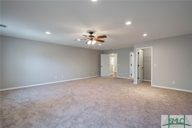 402 Walthour Dr, Rincon, GA 31326 - unfurnished bedroom featuring recessed lighting, light colored carpet, baseboards, a textured ceiling, and a spacious closet