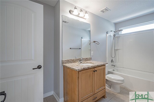 402 Walthour Dr, Rincon, GA 31326 - full bathroom featuring toilet, tile patterned floors, tub / shower combination, vanity, and a textured ceiling