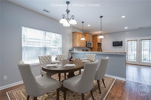 402 Walthour Dr, Rincon, GA 31326 - dining area with baseboards, wood finished floors, and recessed lighting