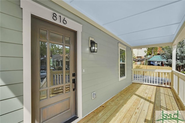 doorway to property featuring a porch