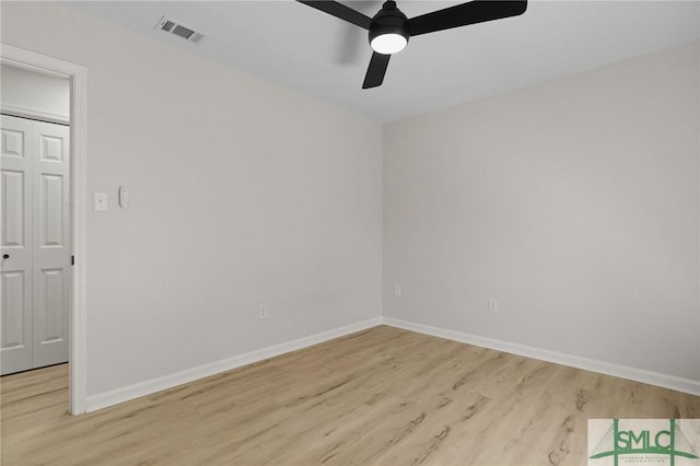 unfurnished room with baseboards, ceiling fan, visible vents, and light wood finished floors