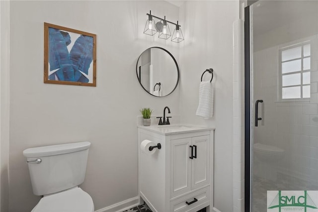 full bathroom featuring baseboards, toilet, a stall shower, and vanity