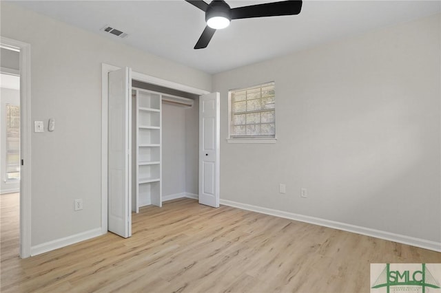 unfurnished bedroom featuring ceiling fan, baseboards, light wood finished floors, and visible vents