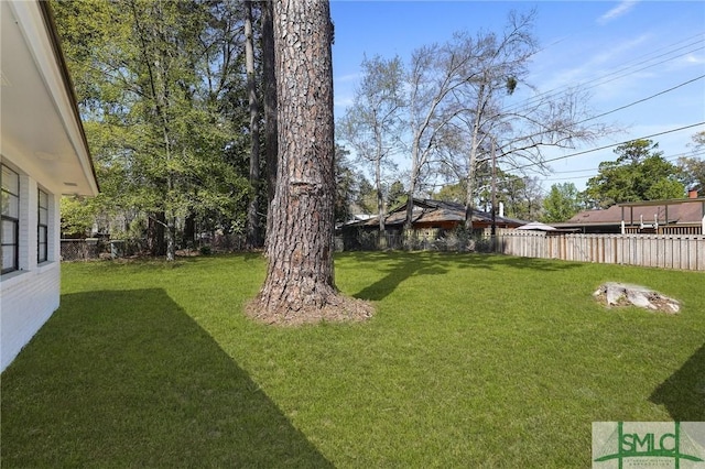 view of yard with fence