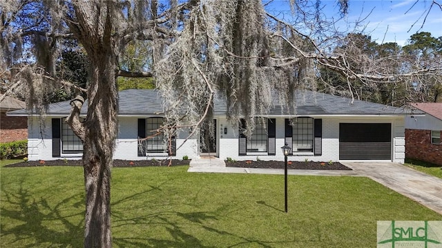 view of front of house featuring a front yard, a garage, brick siding, and concrete driveway