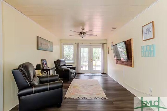 living room with dark wood finished floors, ceiling fan, and french doors