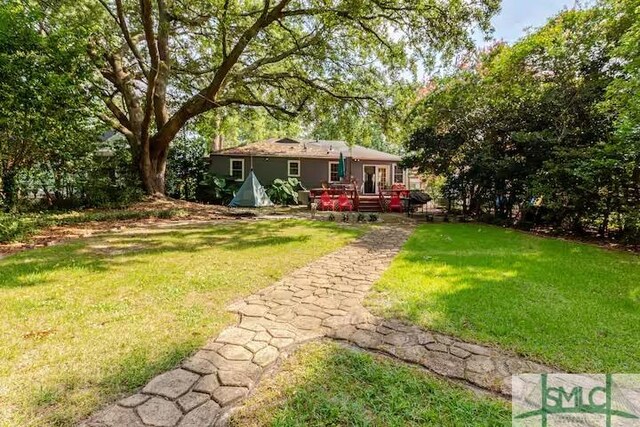view of yard with a deck
