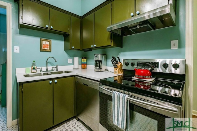 kitchen with a sink, green cabinetry, exhaust hood, and appliances with stainless steel finishes
