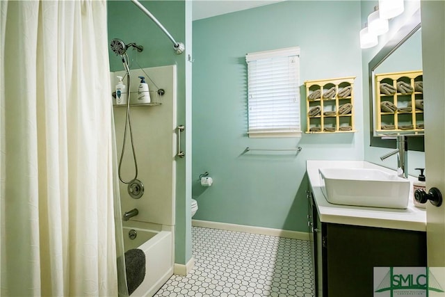 bathroom with baseboards, shower / bath combination with curtain, toilet, and vanity