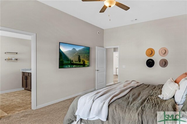 218 Herty Ln, Hinesville, GA 31313 - bedroom featuring light carpet, baseboards, a ceiling fan, and connected bathroom