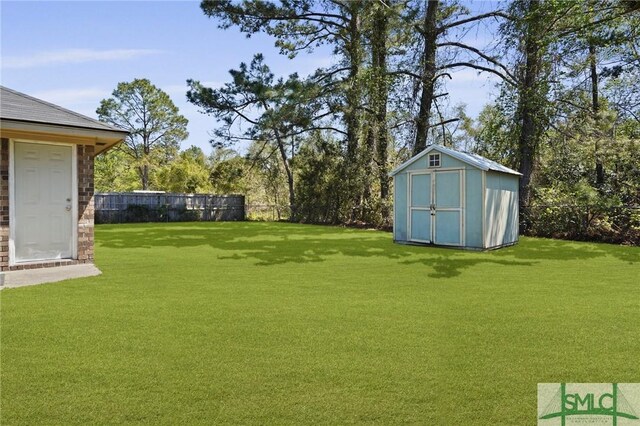 726 Timber Ridge Trl, Hinesville, GA 31313 - view of yard featuring an outbuilding, a storage unit, and fence