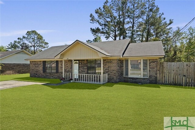 726 Timber Ridge Trl, Hinesville, GA 31313 - ranch-style home with brick siding, fence, a porch, and a front yard