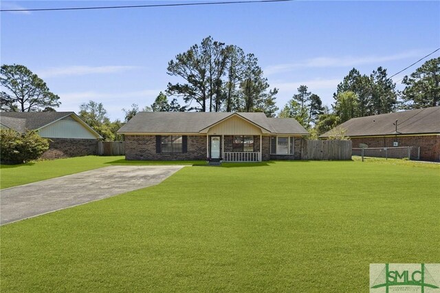 726 Timber Ridge Trl, Hinesville, GA 31313 - ranch-style home featuring a front lawn, driveway, fence, and brick siding