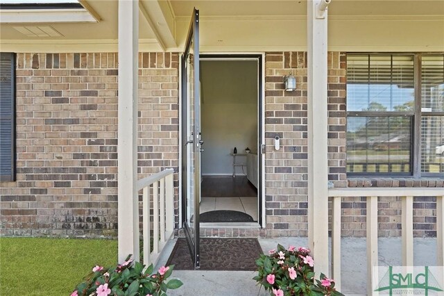 726 Timber Ridge Trl, Hinesville, GA 31313 - view of exterior entry with brick siding