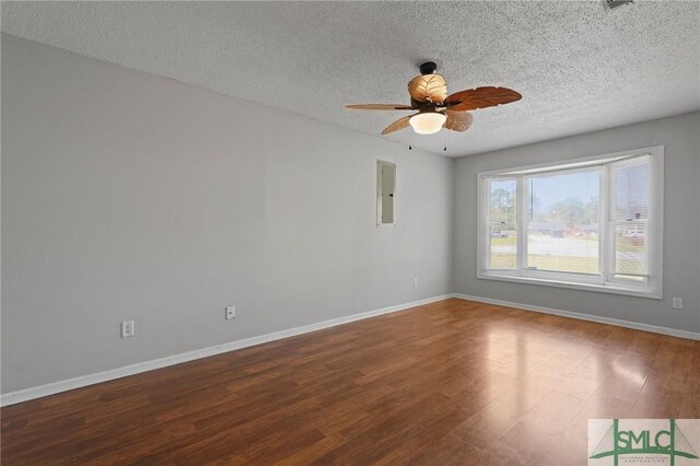 726 Timber Ridge Trl, Hinesville, GA 31313 - unfurnished room with a textured ceiling, baseboards, wood finished floors, and a ceiling fan