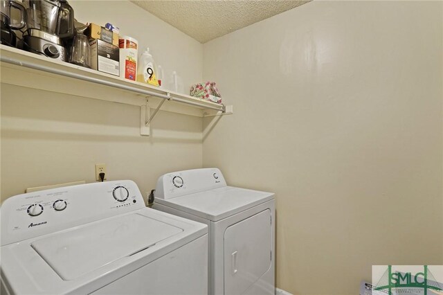 726 Timber Ridge Trl, Hinesville, GA 31313 - laundry area featuring a textured ceiling, laundry area, and washer and clothes dryer