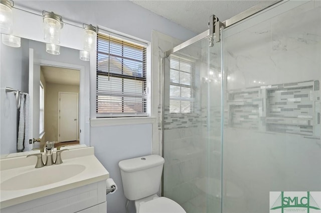 726 Timber Ridge Trl, Hinesville, GA 31313 - bathroom with a textured ceiling, toilet, a stall shower, and vanity