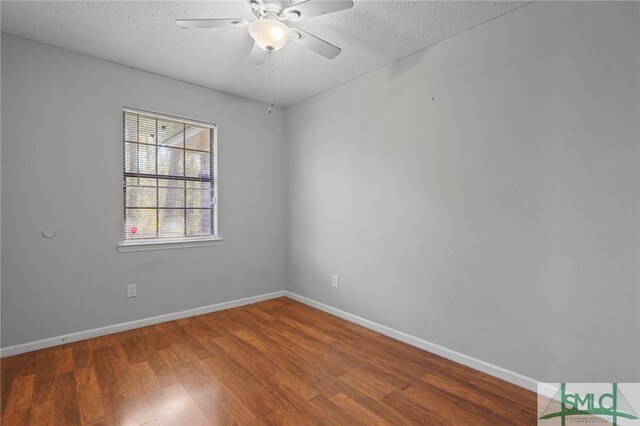 726 Timber Ridge Trl, Hinesville, GA 31313 - spare room with baseboards, a textured ceiling, ceiling fan, and wood finished floors
