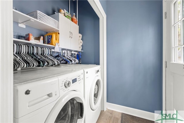90 Cottage Ct, Richmond Hill, GA 31324 - laundry room with baseboards, cabinet space, independent washer and dryer, and light wood-style floors