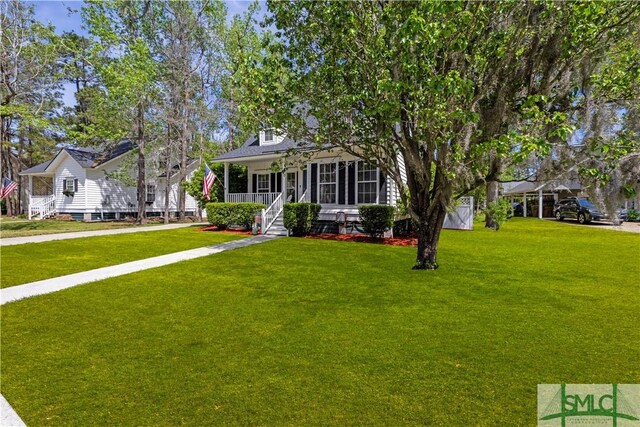 90 Cottage Ct, Richmond Hill, GA 31324 - view of front of property with a front yard and covered porch