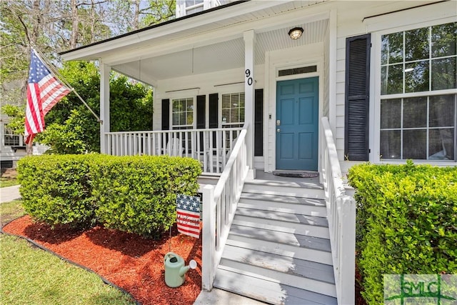 90 Cottage Ct, Richmond Hill, GA 31324 - view of exterior entry with covered porch