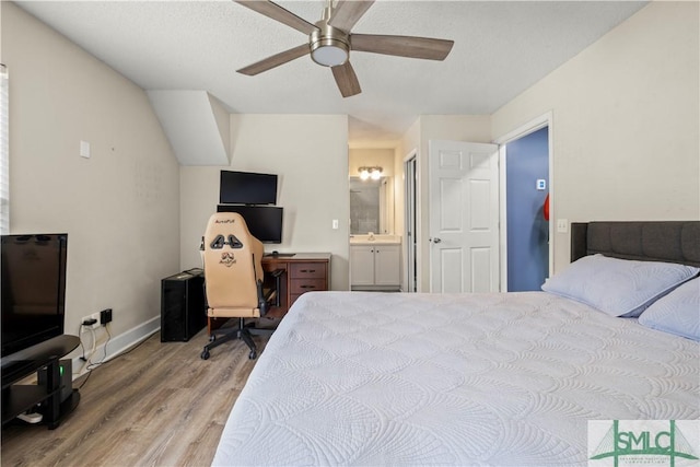 90 Cottage Ct, Richmond Hill, GA 31324 - bedroom featuring baseboards, wood finished floors, ceiling fan, and ensuite bathroom