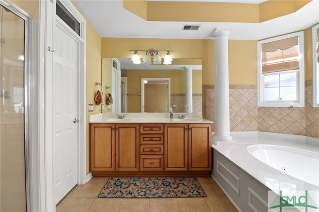 full bathroom featuring decorative columns, tile patterned flooring, a stall shower, and visible vents