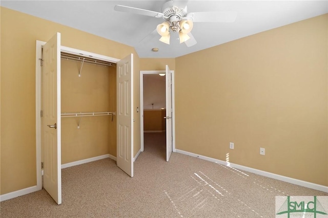unfurnished bedroom with a closet, carpet floors, ceiling fan, and baseboards